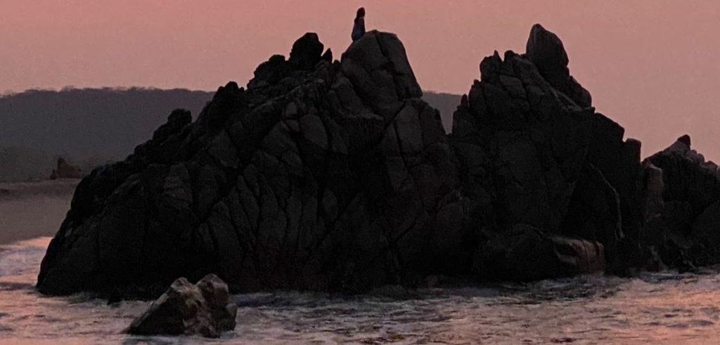 the rocks and dawn at La Bocana beach.