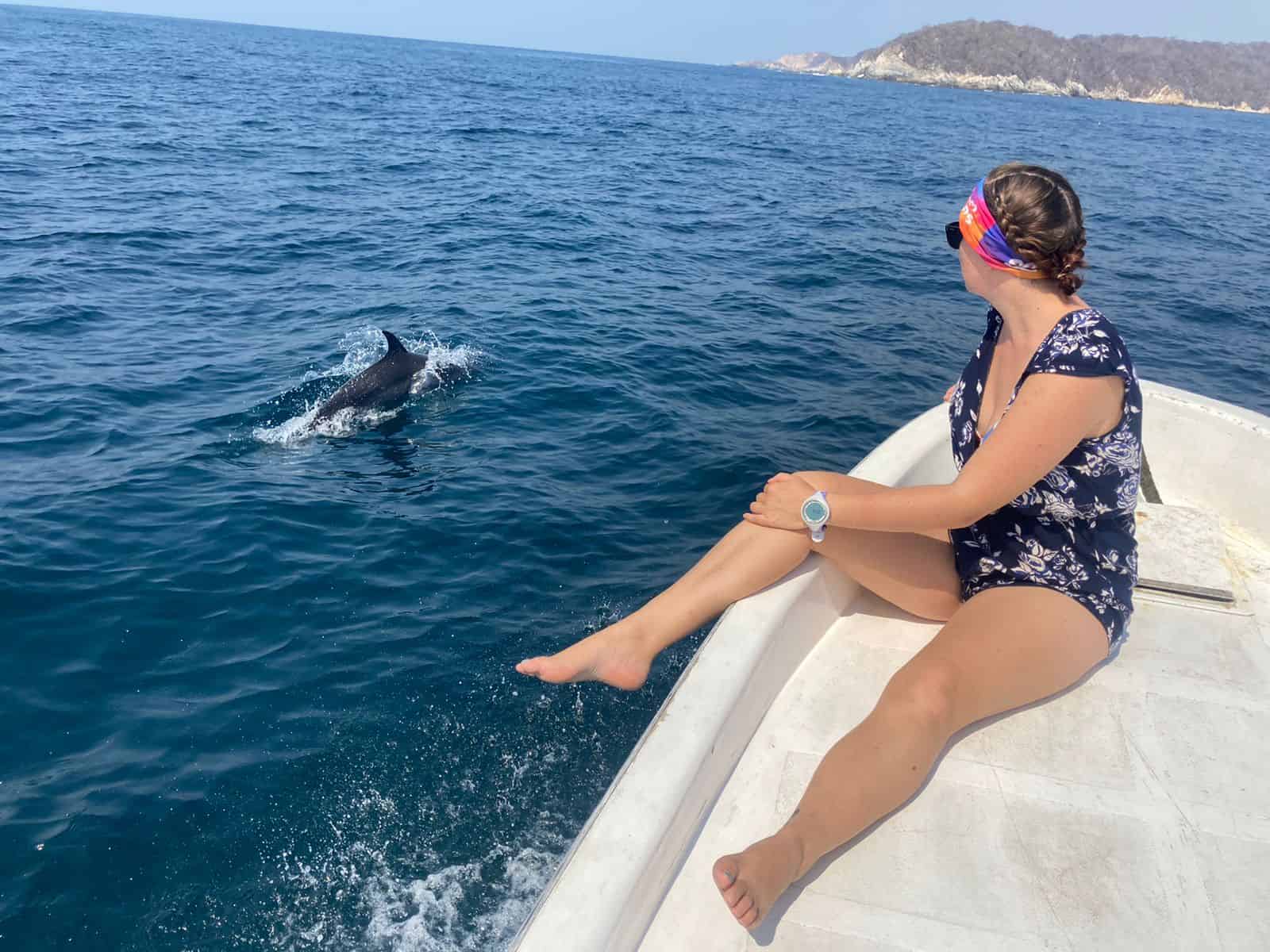 Just another day at the office, hanging with dolphins on our way to a dive site in Huatulco