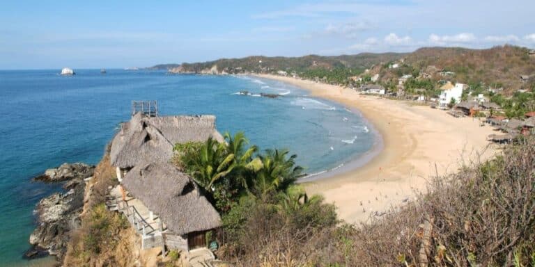 One of Oaxaca's beach towns, San Agustinillo is home to a long crescent shaped beach, protected from the Pacific ocean waves