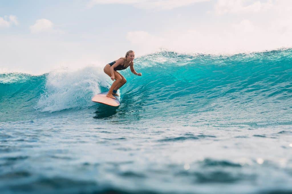 a woman surfing the mexican pipeline in Puerto Escondido Oaxaca
